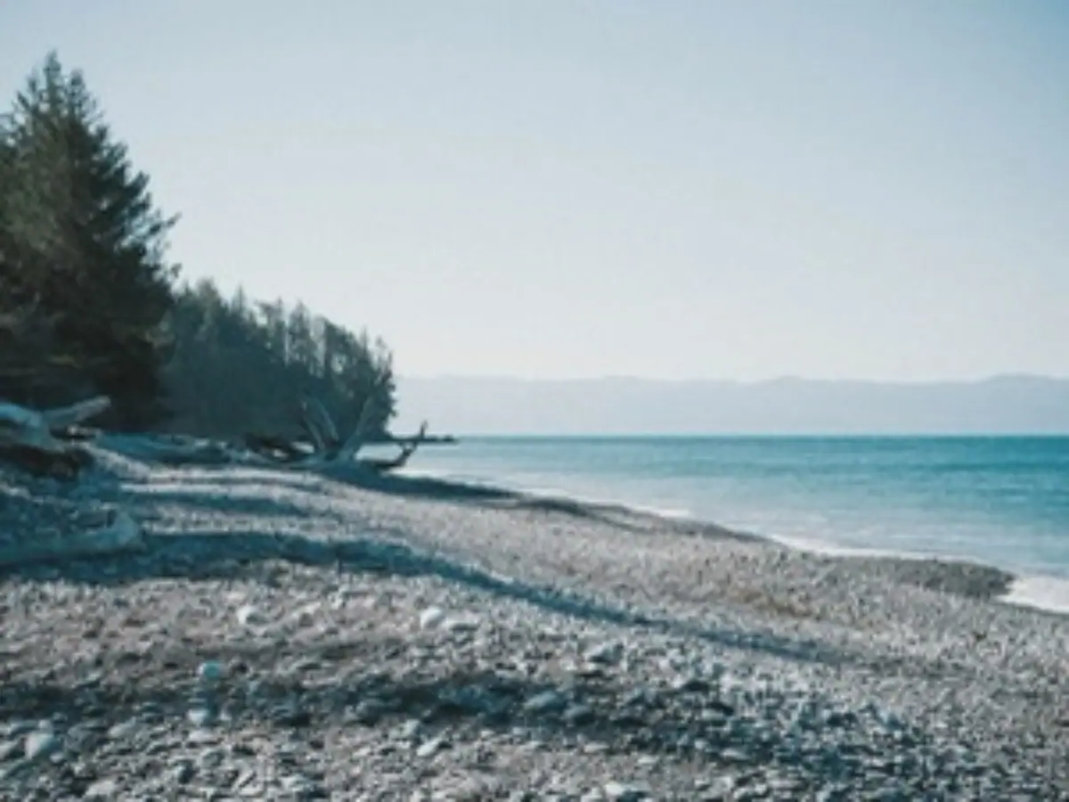 Low-resolution beach photograph before AI enhancement
